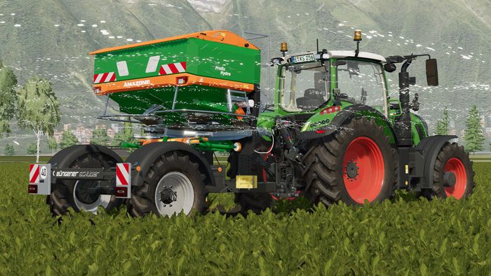 Der Buengener Und Schuder FSG in Aktion mit einem Amazone Streuer. Screenshot aus dem Farming Simulator 22